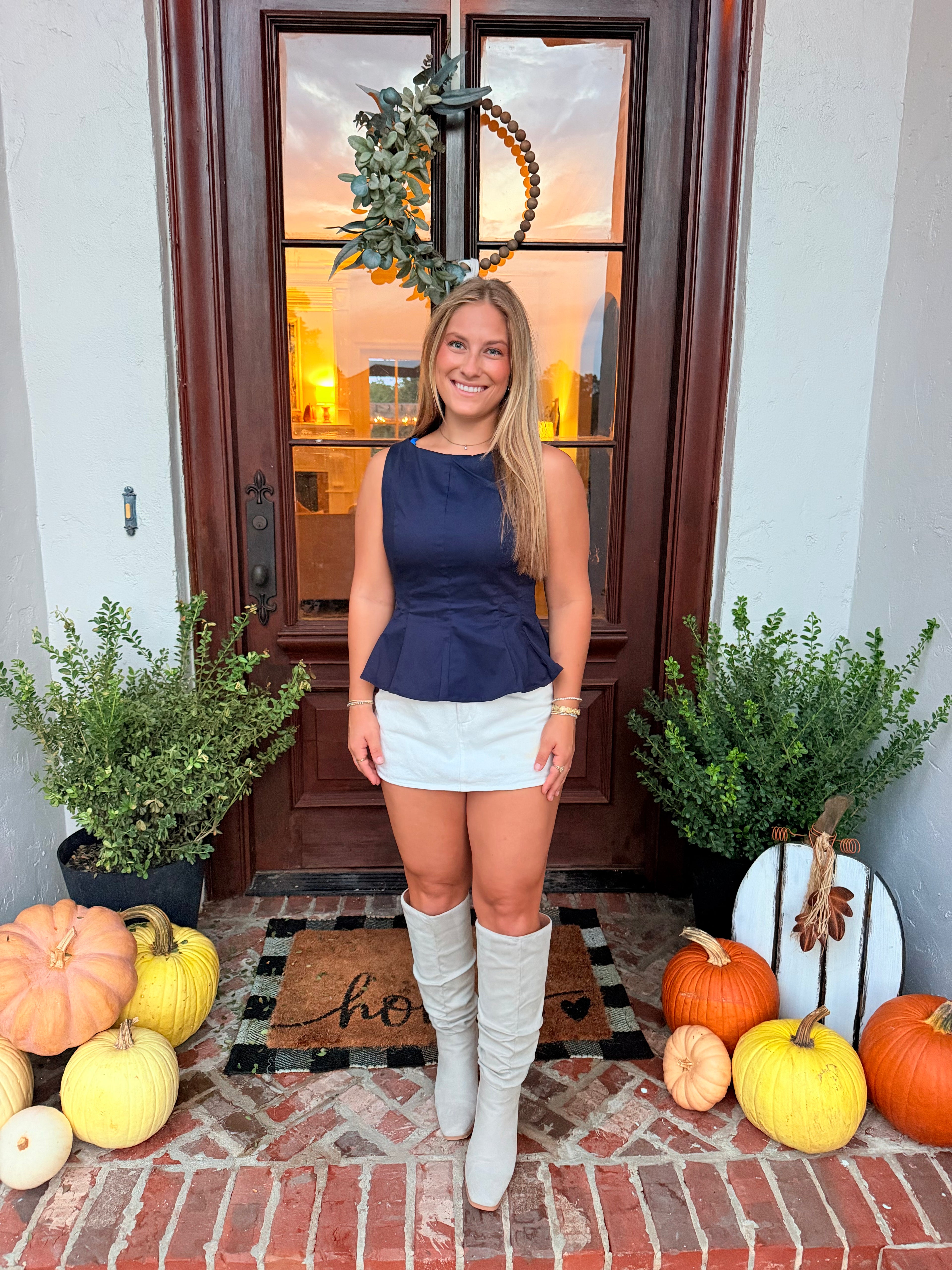 Navy boat neckline fit with flare sleeveless top
